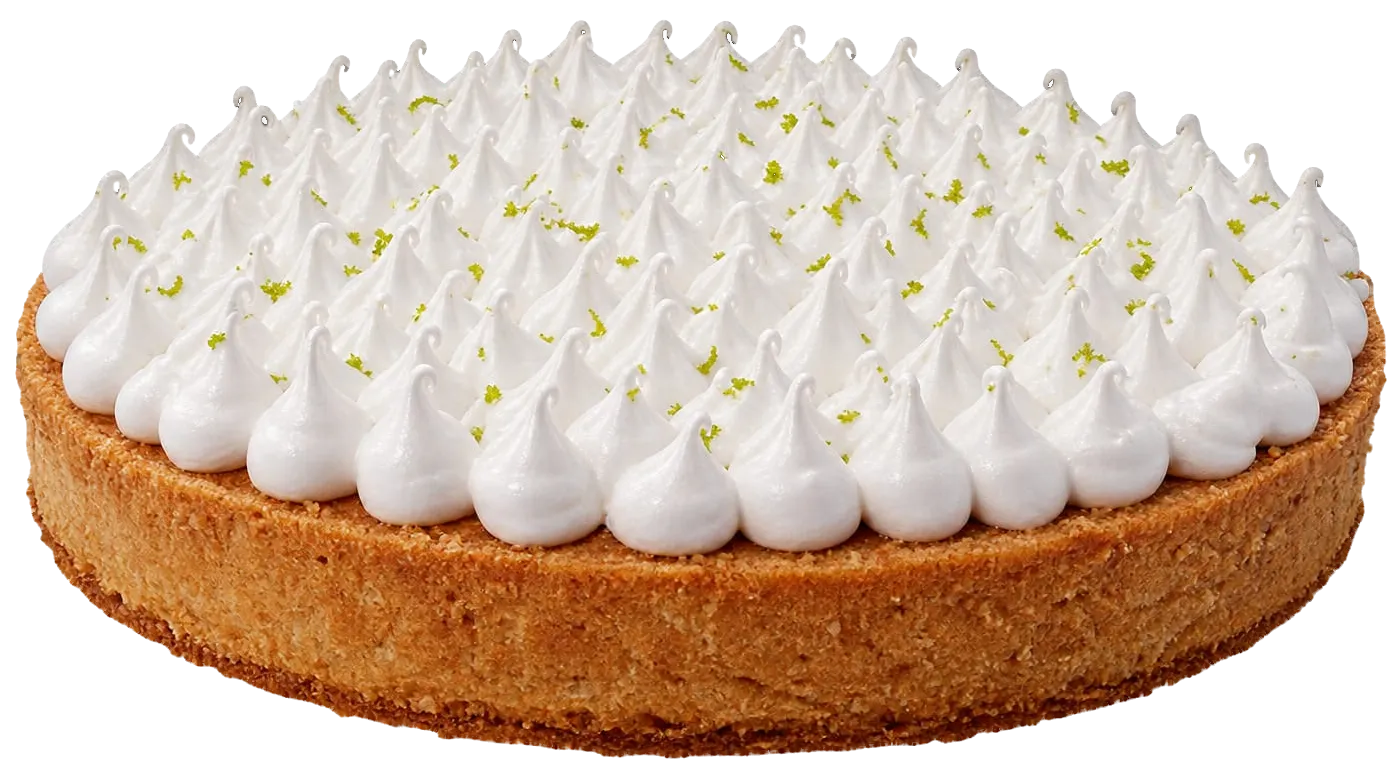 Tarta redonda de base de galleta gruesa, cubierta de picos de merengue con ralladura de lima.